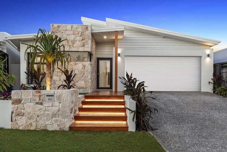 Coastal home exterior with rendered steps and clean lines